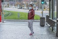 11/16/2020. Prague. Czech Republic. A man wearing a mask is waiting for a tram at Hradcanska tram stop during quarantine