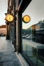 Prague, Czech Republic, March 9, 2022: Big luminous clock on The Old Town Square is reflecting on glass case