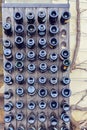 Empty wine bottles sitting in a wood stand Royalty Free Stock Photo