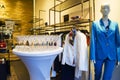 Prague, Czech Republic -10 March 2019 : Interior of a women's fashion store with clothes hangers. Royalty Free Stock Photo