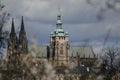 Prague, Czech Republic, 26 March 2023: Panorama of old town from Petrin Hill, Red roofs, Cloudy spring day, High spires medieval