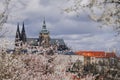 Prague, Czech Republic, 26 March 2023: Panorama of old town from Petrin Hill, Red roofs, Cloudy spring day, High spires medieval