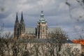 Prague, Czech Republic, 26 March 2023: Panorama of old town from Petrin Hill, Red roofs, Cloudy spring day, High spires medieval