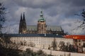 Prague, Czech Republic, 26 March 2023: Panorama of old town from Petrin Hill, Red roofs, Cloudy spring day, High spires medieval