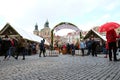 Prague, Czech Republic- March 27, 2018: People are celebrate easter on Old Town square. View on a Church of St. Nicholas. Royalty Free Stock Photo