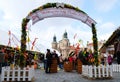 Prague, Czech Republic- March 27, 2018: People are celebrate easter on Old Town square. View on a Church of St. Nicholas. Royalty Free Stock Photo