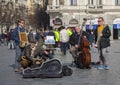 Prague, Czech Republic - March 13, 2017: Quartet of Musicians playing musical instruments for tourists on the street in Prague Royalty Free Stock Photo