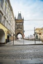 Prague, Czech republic - March 19, 2020. Square Krizovnicke namesti in front of entrance to Charles Bridge without tourists during