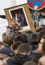 A child in front of the caricature of Milos Zeman shown as an evil clown at the demonstration on Prague Wenceslas square