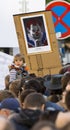 A child in front of the caricature of Milos Zeman shown as an evil clown at the demonstration on Prague Wenceslas square