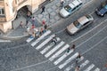 Prague, Czech Republic - May 12, 2019: Group of people walks across a crosswalk