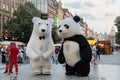 Prague, Czech Republic - May 26, 2018: Men dancing in a Polar bear and Panda bear fancy dress costumes entertains a crowd of