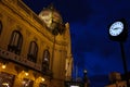 Prague, Czech Republic - May 16, 2012: Municipal House Obecni dum. Facade, dome, balcony and flags next to a street clock on
