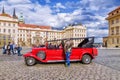 PRAGUE. CZECH REPUBLIC - MAY 17, 2016: A red retro car on the sq Royalty Free Stock Photo
