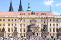 PRAGUE, CZECH REPUBLIC - MAY 2017: Tourists in front of Prague Castle entrance, is a castle complex in Prague. It is the official Royalty Free Stock Photo