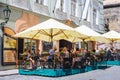 PRAGUE, CZECH REPUBLIC - MAY 2017: Tourists outside cafe, restaurant in the old town of Prague. Royalty Free Stock Photo