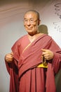 PRAGUE, CZECH REPUBLIC - MAY 2017: wax statue of the Dalai Lama monument in the wax statue museum in the Czech Republic in the cap Royalty Free Stock Photo