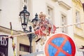 Witch puppet sitting above the street next to Prague puppet boutique Royalty Free Stock Photo