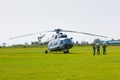 PRAGUE, CZECH REPUBLIC - 9.09.2017: Military helicopter and tree soldiers in airport Letnany in Prague Royalty Free Stock Photo