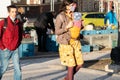 11/16/2020. Prague, Czech Republic. A mother is crossing the street with her small child close to Hradcanska tram stop during