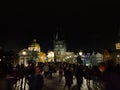 Prague, Czech Republic - Nov 02, 2018 People are corssing Saint Charles Bridge at night. View towards Prague Old Town Royalty Free Stock Photo