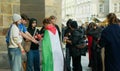 PRAGUE, CZECH REPUBLIC, NOVEMBER 1, 2023: Activist people free Gaza blood genocide hand supporters red signs flag