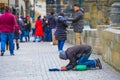 Beggar on The Charles Bridge in Prague