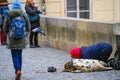 beggar on The Charles Bridge in Prague