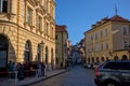 Atmospheric narrow curved street in the old district of Prague.