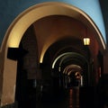 A dim lamp illuminates the ancient arcade Royalty Free Stock Photo