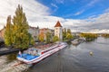 Dramatic view on Vltava river, tourist ship, Prague city center, Saints Vitus Cathedral and Prague Castle, Prague, Czech Republic Royalty Free Stock Photo