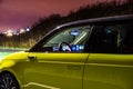 Prague, Czech republic - October 26, 2020. Night photo of interior through the window with dashboard on of electronic Honda e