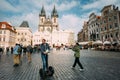 Tourist rides a electric scooter Segway on old square on background of the Church Of Our Lady Before Tyn In Old Town Royalty Free Stock Photo