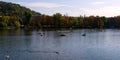 Tourists in small boats ride along the Vltava in the autumn. Rest on the river. Autumn