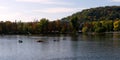 Tourists in small boats ride along the Vltava in the autumn. Rest on the river. Autumn