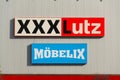 XXXLutz Mobelix corporation logo on supermarket building