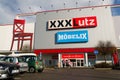 XXXLutz Mobelix corporation logo on supermarket building