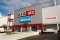 XXXLutz Mobelix corporation logo on supermarket building