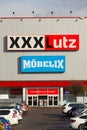 XXXLutz Mobelix corporation logo on supermarket building