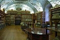 Prague, Czech Republic: old library with globes and a lot of books inside decorated shelves Theological hall,