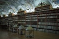 Prague, Czech Republic: old library with globes and a lot of books inside decorated shelves Theological hall, Royalty Free Stock Photo