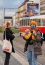 People on a winter day facing quarantine. Man, woman, mums, child, old and young people outdoors. Prague 6 Royalty Free Stock Photo