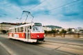 Prague, Czech Republic. Public old retro tram moving on bridge