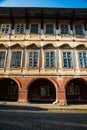 Prague, Czech republic - September 19, 2020. Architectonic details of building in Pohorelec street - arcades and windows of Slikuv