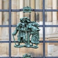 Prague, Czech Republic - September 23, 2019. A copper bas-relief on the fence of St. Vitus Cathedral depicting rural life Royalty Free Stock Photo