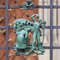 Prague, Czech Republic - September 23, 2019. A copper bas-relief on the fence of St. Vitus Cathedral depicting rural life Royalty Free Stock Photo