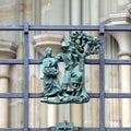 Prague, Czech Republic - September 23, 2019. A copper bas-relief on the fence of St. Vitus Cathedral depicting rural life Royalty Free Stock Photo