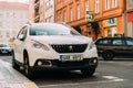 Front View Of White Peugeot 2008 Car Parked In Street. Mini Sport