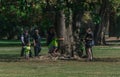 Prague, Czech Republic - September 10, 2019: kids hugging a tree under parents supervision Royalty Free Stock Photo