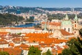 Prague, Czech republic - September 19, 2020. Orange roofs of Old Town in contrast with blue river Vltava/Moldau Royalty Free Stock Photo
